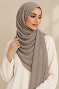 Model wearing a Warm Taupe modal hijab in a side-facing pose