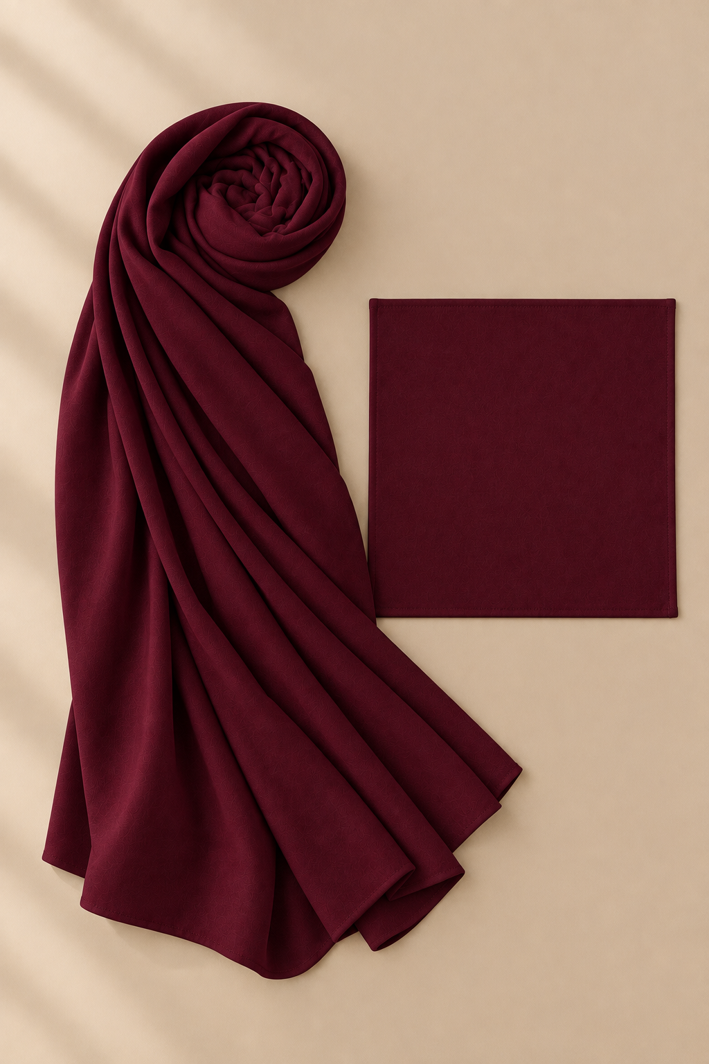 Burgundy modal hijab beside matching open square undercap