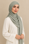 Model wearing a Sage modal hijab in a relaxed angled pose