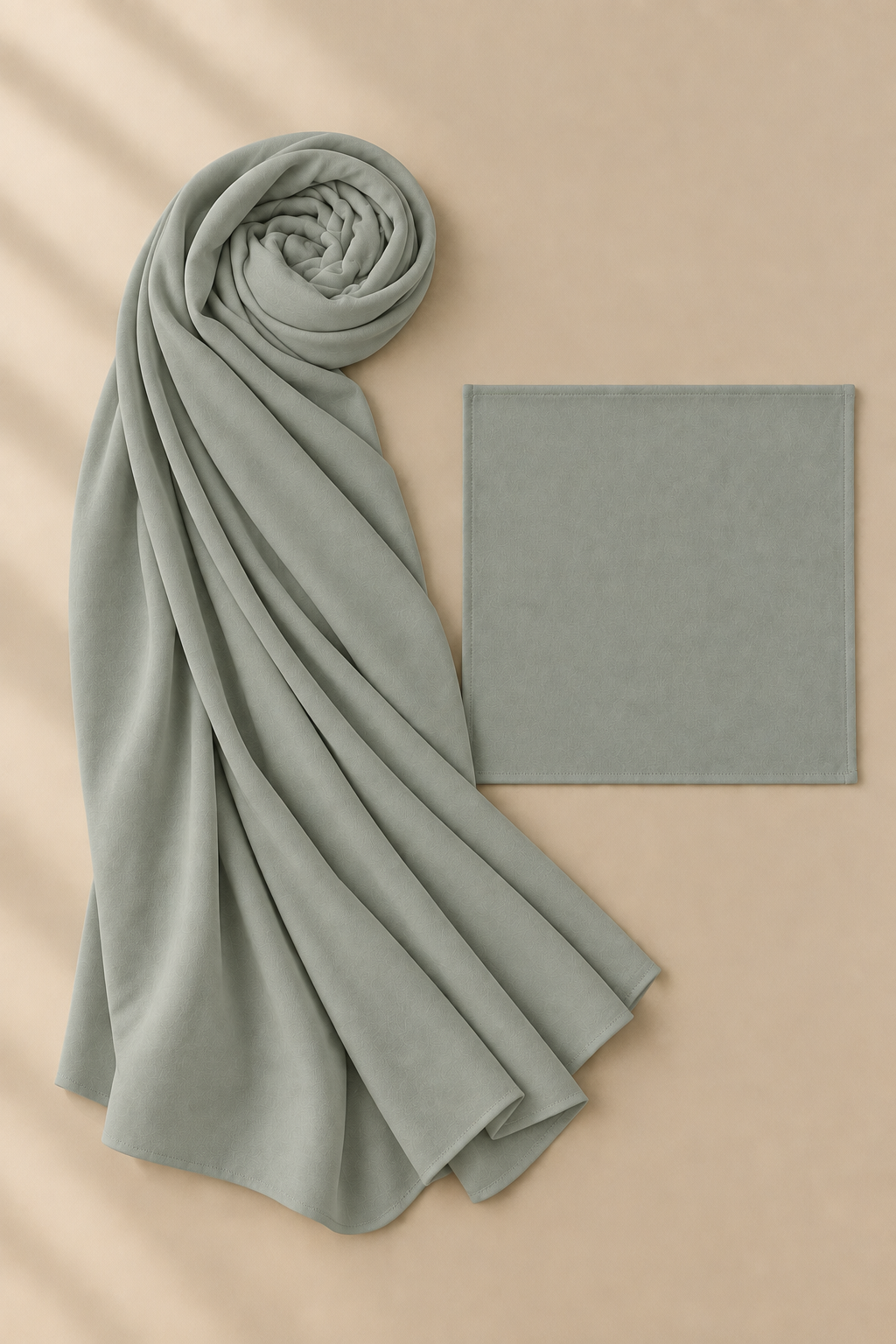 Sage modal hijab beside its matching open square undercap