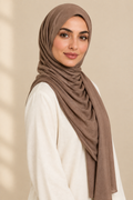 Model wearing a Mocha modal hijab in a turned pose